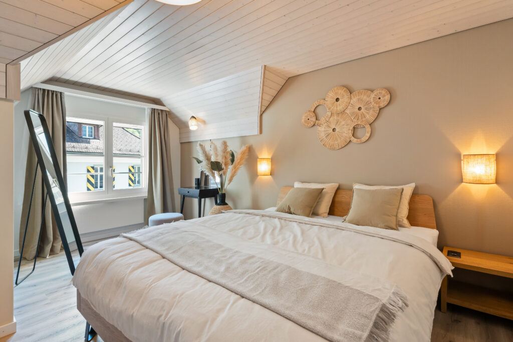 Modern Swiss holiday apartment bedroom in Altdorf with Alpine-style decor – Interalps Switzerland